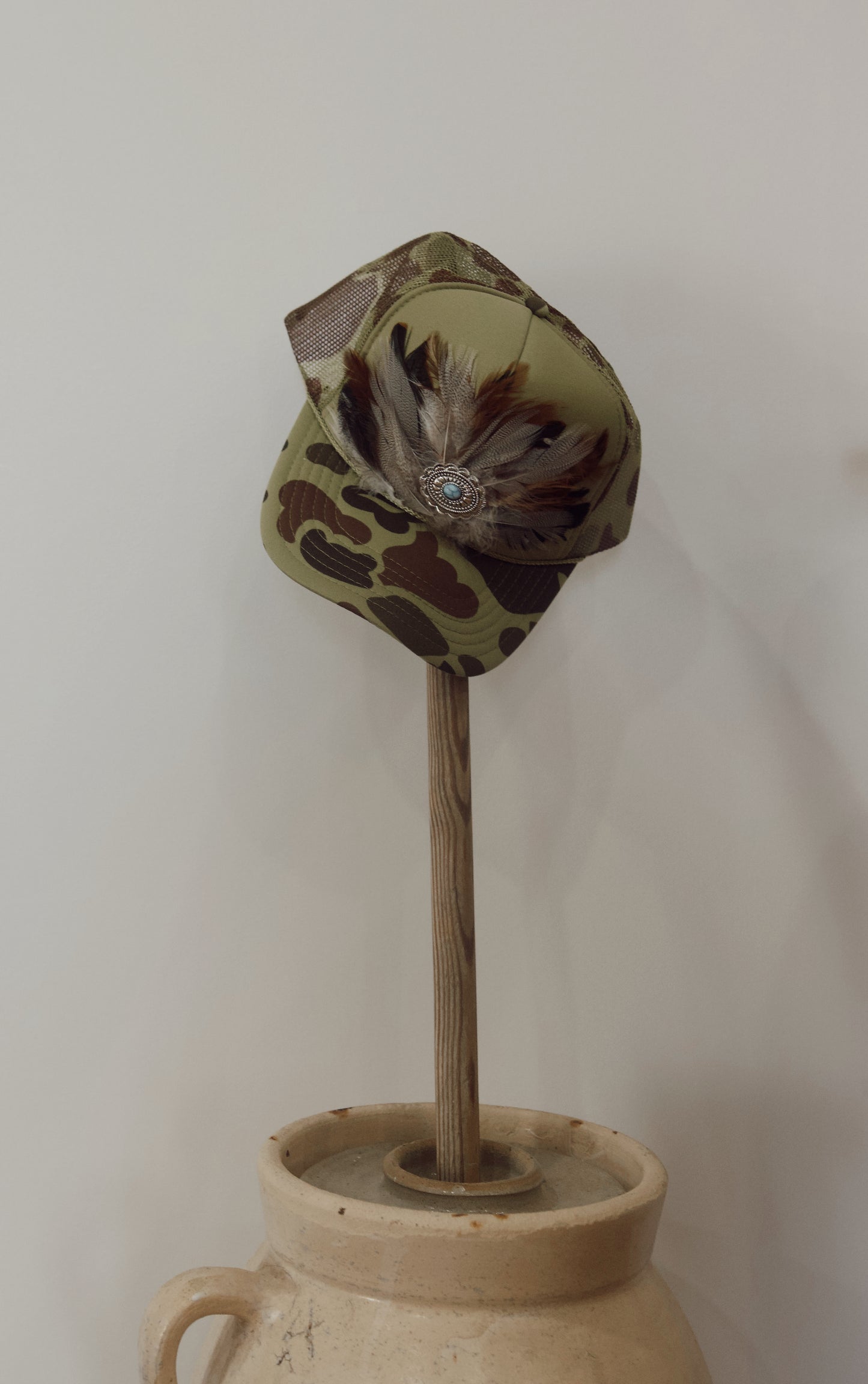 “Hank” Camo Feather Crest Trucker Hat